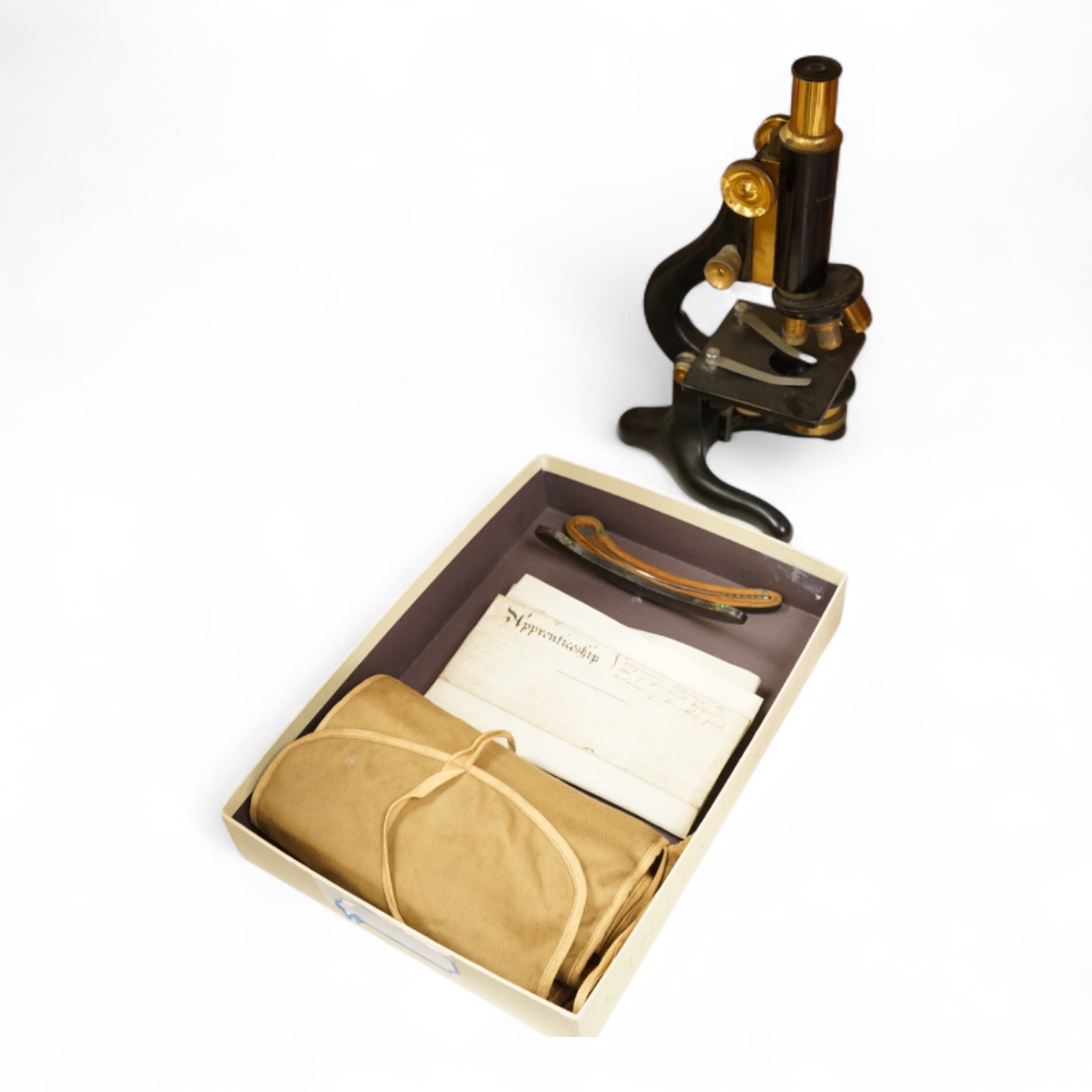 A parchment Indenture of Apprenticeship as a Surgeon and Apothecary between Nicholas Adams and Robert Seymour Adams of Hampshire, dated 1849, an early 20th century monocular brass microscope by W. Watson & Sons, 31cm hig
